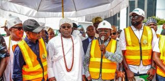 His Excellency, President Asiwaju Ahmed Tinubu, GCFR, represented by the Minister of Works, Sen. Engr. David Umahi, CON (2nd right), opening the road together with the Representative of the Governor and Commissioner of Transportation, Hon. Oluwaseun Osinyemi (1st right), the Chairman, Senate Committee on Works, Sen. Barinada Mpigi (1st left), and His Royal Majesty, Oba Abdul-Wasiu Omogbolahan Lawal (2nd right) the Oniru of Iru Land.