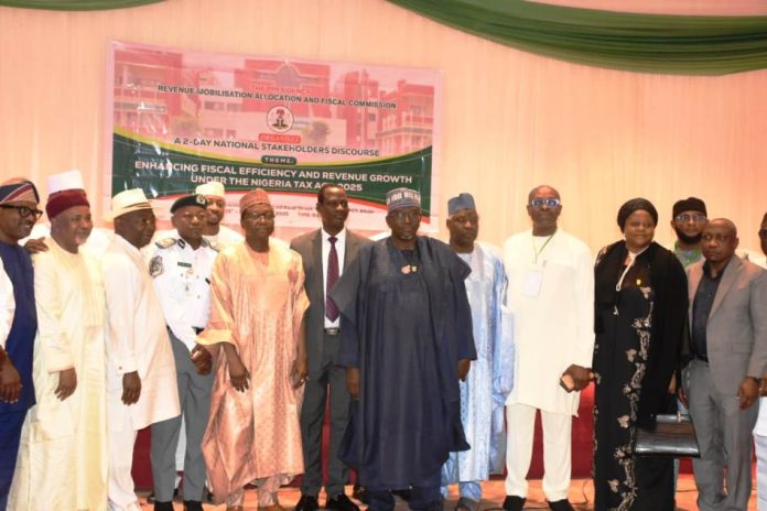 National Stakeholders’ Discourse 7th from L: RMAFC Chairman, Dr. Mohammed Bello Shehu OFR in a group photograph with RMAFC Members and Distinguished guests at the National Discourse.