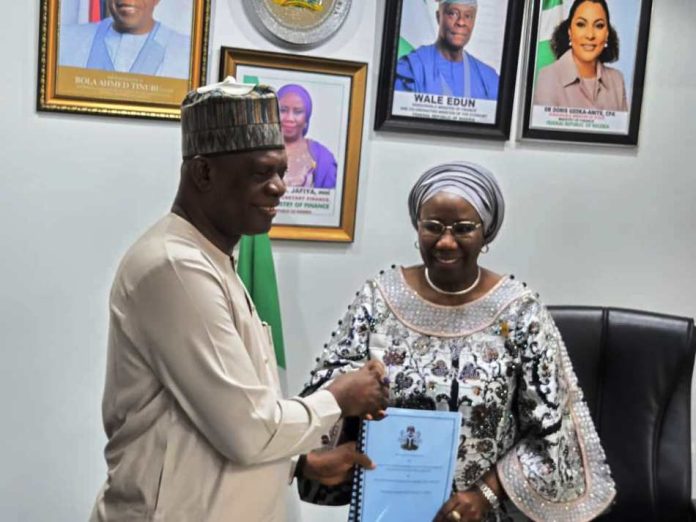 Raymond Omachi and Jafiya Raymond Omachi Pledges To Build On The Legacy Of His Predecessor To Drive The Nation's Economy As Jafiya Bows Out Of The Federal Civil Service