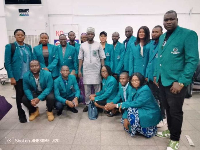 The Volunteers with one of the escorts, a Protocol officer at NTAC, Mr. Hamza, before departing Abuja this morning.
