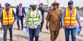 The Minister of Works, Sen. (Engr.) David Umahi flanked by the Permanent Secretary, Mr. Rafiu Adeladan (right), Otunba Segun Showunmi (left) and the Acting Director, Highways (Bridges and Design), Engr. Musa Sa’idu (extreme left) on the completed Keffi Flyover, yesterday.