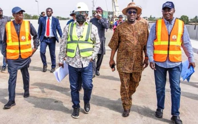 The Minister of Works, Sen. (Engr.) David Umahi flanked by the Permanent Secretary, Mr. Rafiu Adeladan (right), Otunba Segun Showunmi (left) and the Acting Director, Highways (Bridges and Design), Engr. Musa Sa’idu (extreme left) on the completed Keffi Flyover, yesterday.