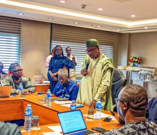 Honourable Minister of State for Health & Social Welfare Dr. Adekunle Salako addressing members of the National Health Research Ethics Committee NHREC, during its 2026 Face- to- Face meeting and Training Workshop in Abuja, and On his immediate right: Dr. Kamil Shoretire Director/Head, Health Planning Research Statistics Department FMoHSW, also On his immediate left: Professor Richard Adegbola Chairman NHREC.