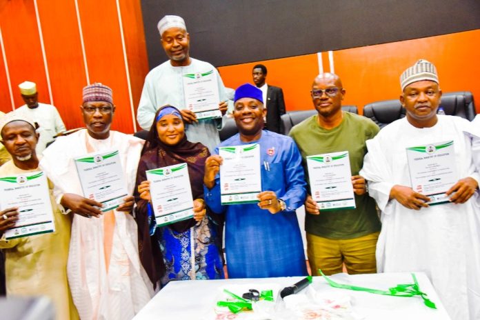 Hon. Minister of Education, Dr Maruf Olatunji Alausa (M) along with Hon Minister of State for Educationn; Prof. Suwaiba Sa'id Ahmed and others unveiling agreements between the Federal Government of Nigeria and the Academic Staff Union of the Universities on Wednesday 14th January, 2026