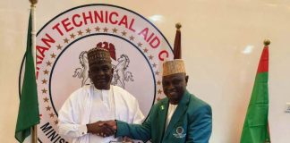 The DG/CEO NTAC pictured presenting the Returnee Volunteer, Prof. Joseph Tanko Apagu (in NTAC Blazers) with the Certificate of Completion