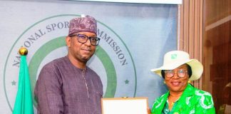 President of Ladies Golf Association of Nigeria Dr. Lami Onayi Ahmed making a presentation to National Sports Commission Chairman Mallam Shehu Dikko when the group visited the Chairman on Thursday.