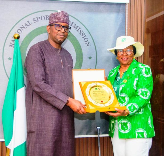 All Africa Challenge Trophy Abuja 2026 President of Ladies Golf Association of Nigeria Dr. Lami Onayi Ahmed making a presentation to National Sports Commission Chairman Mallam Shehu Dikko when the group visited the Chairman on Thursday.