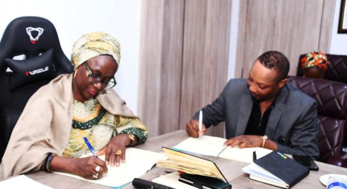 FG partners Stratcomm 2 L-R: The Permanent Secretary, Federal Ministry of Youth Development (FMYD), Dr. Maryam Keshinro, and the Managing Director of Stratcomm Consulting, Dr. Kayode Olanorin, during the signing of the Memorandum of Understanding (MoU).