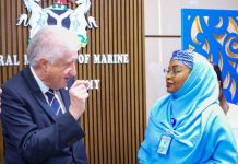 Permanent Secretary, Federal Ministry of Marine & Blue Economy, Fatima Sugra Tabi'a Mahmood (r) listens as Executive Director, Atlantic International Research Centre, Prof. Miguel Miranda outlines the organization's efforts to support Nigeria's maritime sector.