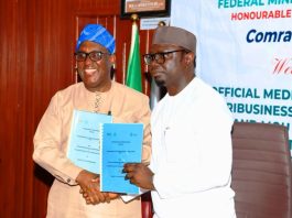 R–L: The Honourable Minister, Federal Ministry of Youth Development, Comrade Ayodele Olawande, and the Director-General, International Institute of Tropical Agriculture (IITA), Dr. Simeon Ehui, displaying the Memorandum of Understanding (MoU) document following its signing during the launch of the Youth in Agribusiness Land Trust Fund (YALTF), today at the Minister’s Office, Abuja.