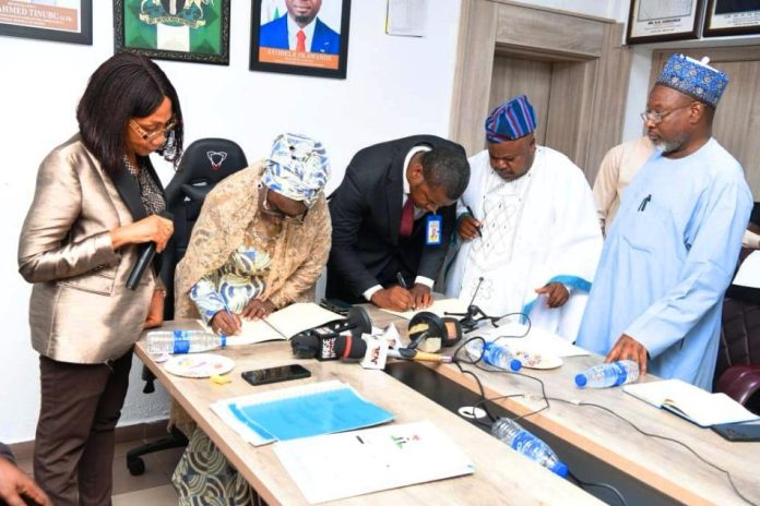 2nd left is the Permanent Secretary, Federal Ministry of Youth Development Dr.(Mrs) Maryam Keshinro while signing the MoUs with both Organisations in Abuja