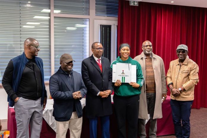 L-R: President NBBF, Engr. Musa Kida, NSC DG, Hon.Bukola Olopade, NSC Chairman Shehu Dikko, Team captain Amy Okonkwo, NBBF Vice President, Babs Ogunade and SSA to the President on Grassroots Sports Adegboye Adeyinka, as federal government delegation to Lyon, France for the presentation of houses gifts and national honours to D'Tigress in fulfilment of the promise by President Bola Ahmed Tinubu last year.