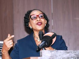 Representative of the Chief Judge of the High Court of the Federal Capital Territory (FCT) and keynote speaker Hon. Justice Angela Otaluka, presenting her keynote address and declaring opened the International Women's Day 2026 Commemoration covened recently at the Olusegun Obasanjo Auditorium, Federal Ministry of Justice Headquarters, Abuja.