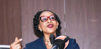 Representative of the Chief Judge of the High Court of the Federal Capital Territory (FCT) and keynote speaker Hon. Justice Angela Otaluka, presenting her keynote address and declaring opened the International Women's Day 2026 Commemoration covened recently at the Olusegun Obasanjo Auditorium, Federal Ministry of Justice Headquarters, Abuja.