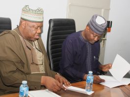 Signing of Handing Over Document by the Outgoing Permanent Secretary and the Incoming Permanent Secretary during the Event.