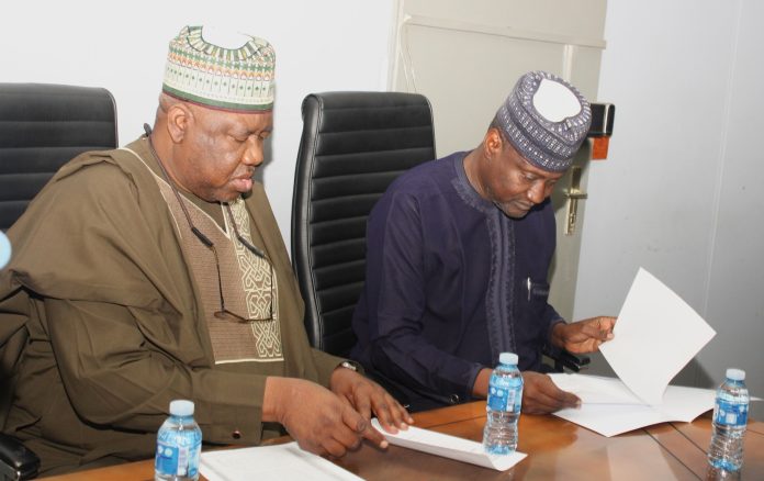 Mahmud Adam Kambari Assumes Duty As Permanent Secretary Signing of Handing Over Document by the Outgoing Permanent Secretary and the Incoming Permanent Secretary during the Event.