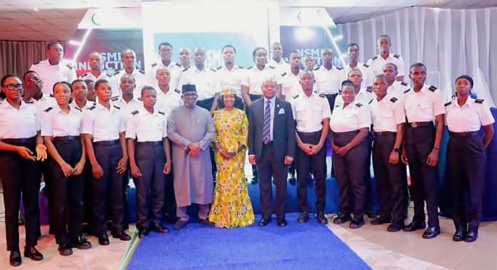 Representative of the Honourable Minister, Director, Information & PR, Federal Ministry of Marine and Blue Economy, Anastasia Ogbonna (m front row), flanked by the Acting Rector, Maritime Academy of Nigeria, Oron, Dr. Kevin Okonna (r,), and Managing Director, NLNG Shipping and Marine Services Limited (NSML), Abdulkadir Ahmed (l) with first batch of thirty (30) cadets from Maritime Academy of Nigeria (MAN), Oron, inducted by NLNG Shipping and Marine Services Limited (NSML) for their mandatory one-year sea-time experience.