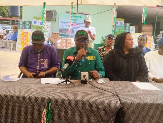 during the flag-off ceremony. The Representative of the Minister of Agriculture and Food Security and Permanent Secretary, Dr Marcus Olaniyi Ogunbiyi (C)during the flag-off ceremony.