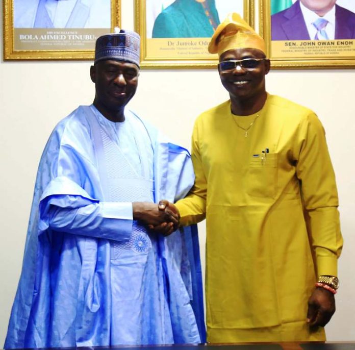 handing over Ceremony The outgoing Perm. Sec. of the Federal Ministry of Industry, Trade & Investment (FMITI), Amb. Nura Abba Rimi (left) and the incoming Perm. Sec. , Dr. Chris Osa Isokpunwu (right), in hand shake during the handing over Ceremony held on Friday 13/3/26.