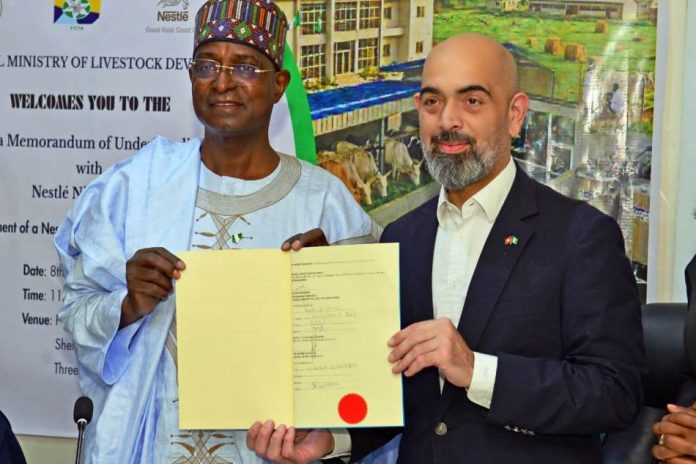 The Honourable Minister Federal Ministry of Livestock Development, Idi Mukhtar Maiha at the centre flanked by the MD /CEO Nestle Nigeria Plc, Mr Wassim Elhussienni, during the Mou signing ceremony today in Abuja.