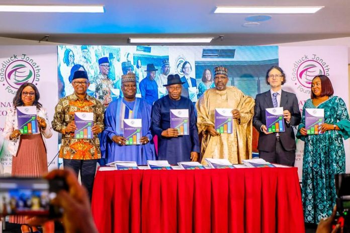 (L-R) Rep. of the Executive Chairman of the Economic and Financial Crimes Commission (EFCC), Ola Olukoyede; Fmr. Governor of Anambra State, H.E Peter Obi; Rep. of the Secretary to the Government of the Federation, Permanent Secretary, (GSO), Dr. Ibrahim Abubakar Kana, mni; the Fmr. President, Federal Republic of Nigeria, H.E Goodluck Ebele Jonathan, GCFR; the Special Adviser on General Duties to the Vice President of Nigeria, Aliyu Modibo Umar and the Executive Director, Goodluck Jonathan Foundation, Ann Iyonu, displaying the Report on strengthening the nexus between democracy and economic growth in Nigeria organised by Goodluck Jonathan Foundation at Transcorp Hilton Hotel, Abuja on Thursday, 9th April, 2026.