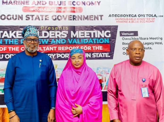 The Permanent Secretary, Federal Ministry of Marine and Blue Economy, FMMBE, Mrs. Fatima Sugra Tabi'a Mahmood, (m), the representative of the Ogun State Governor and Ogun State Commissioner for Transport, Engr. Gbenga Dairo (l) and the Director, Maritime Services Department, FMMBE, Oyinloye Adeola Meshack at the Stakeholders meeting on the review and validation of the report by the consultants for the Ijebu-Ode Inland Dry Port in Abeokuta.