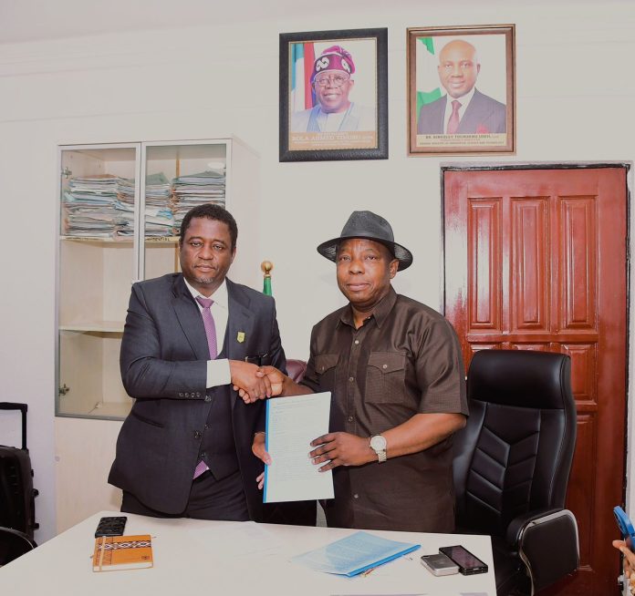 IMG-20260415-WA0157 Outgoing Permanent Secretary, FMIST, Mr. Philip Ndiomu Ebiogeh (right) handing over document to the New Permanent Secretary, Federal Ministry of Innovation, Science and Technology (FMIST) Dr. Mukhtar Yawale Muhammad, (left) today in Abuja.