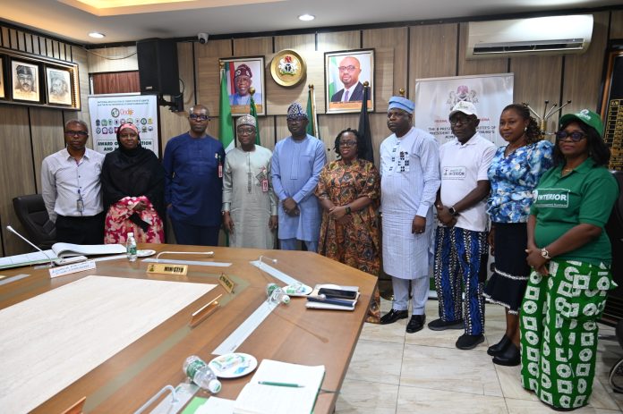 4th L: RMAFC Chairman, Dr. Mohammed Bello Shehu OFR; 5th L: Dr. Olubunmi Tunji-Ojo; 6th L: Permanent Secretary, Ministry of Interior, Dr. Magdalene Ajani in a group photograph with members of the Commission and Directors of the Ministry of Interior.