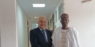 The Honourable Minister, Federal Ministry of Livestock Development Idi Mukhtar Maiha, in a handshake with the CEO of MCI Sante' Animale, Dr. Tadiaoui Omari Khalid, today in his office.
