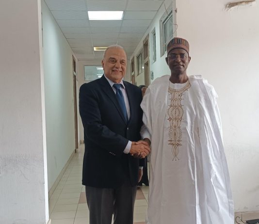The Honourable Minister, Federal Ministry of Livestock Development Idi Mukhtar Maiha, in a handshake with the CEO of MCI Sante' Animale, Dr. Tadiaoui Omari Khalid, today in his office.