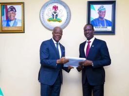 Former Minister of Finance and Coordinating Minister of the Economy Mr. Wale Edun handing over the baton of Office to Mr. Taiwo Oyedele Minister of Finance and Coordinating Minister of the Economy