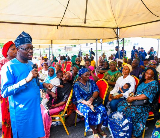 Honourable Minister of Humanitarian Affairs and Poverty Reduction, Dr. Bernard M. Doro, interacting with the beneficiaries of the Household Prosperity and Empowerment Cash Transfer Programme (HOPE-CT) in Kwara State.