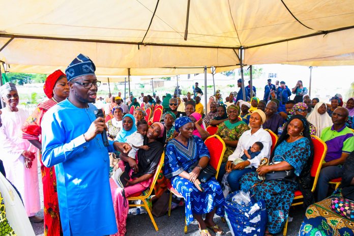 Honourable Minister of Humanitarian Affairs and Poverty Reduction, Dr. Bernard M. Doro, interacting with the beneficiaries of the Household Prosperity and Empowerment Cash Transfer Programme (HOPE-CT) in Kwara State.