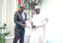 NTAC DG/CEO, RT. HON. YUSUF BUBA YAKUB PRESENTING A COMMEMORATIVE PLAQUE AND NTAC MAGAZINE TO GRENADA'S MINISTER OF FOREIGN AFFAIRS, HON. JOSEPH ANDALL, AFTER BILATERAL DELIBERATIONS.