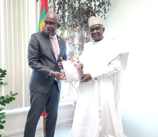 NTAC DG/CEO, RT. HON. YUSUF BUBA YAKUB PRESENTING A COMMEMORATIVE PLAQUE AND NTAC MAGAZINE TO GRENADA'S MINISTER OF FOREIGN AFFAIRS, HON. JOSEPH ANDALL, AFTER BILATERAL DELIBERATIONS.