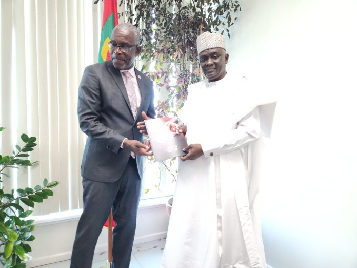 NTAC DG/CEO, RT. HON. YUSUF BUBA YAKUB PRESENTING A COMMEMORATIVE PLAQUE AND NTAC MAGAZINE TO GRENADA'S MINISTER OF FOREIGN AFFAIRS, HON. JOSEPH ANDALL, AFTER BILATERAL DELIBERATIONS.