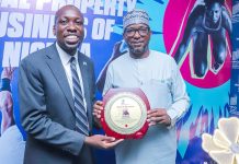 Director World Intellectual Property Organization (WIPO) Nigeria Office Dr. Moody Oluwatobilola presenting an award of appreciation to National Sports Commission Chairman Mallam Shehu Dikko