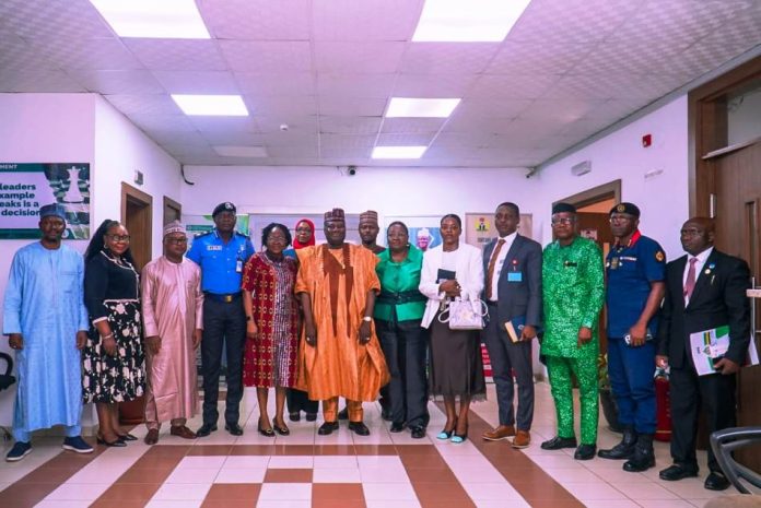 The representative of the Secretary to the Government of the Federation and Permanent Secretary, (GSO), Dr. Ibrahim Abubakar Kana mni, (7th left) in a group photograph with the members of the Inter-Ministerial Committee on the Proliferation and Rationalization of Security and Paramilitary Agencies during the inauguration ceremony on Wednesday 22nd April, 2025 in Abuja.