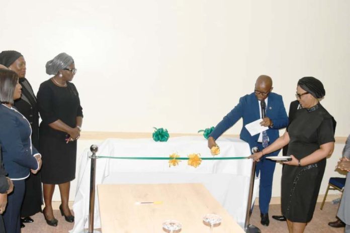 Hon. Justice Obiora Egwuatu of the Federal High Court, assisted by the Director Administration of Criminal Justice and Reform Department, Mrs. Leticia Ayoola-Daniels, Prof. Yemi Akinseye George and other guests during the unveiling of the two documents at Abuja Continental Hotel on 14th April, 2026.