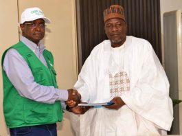The Honourable Minister of Federal Ministry of Livestock Development Idi Mukhtar Maiha in an handshake with the National President of the National Association of Donkey Farmers in Nigeria, Alhaji Abubakar kagu.