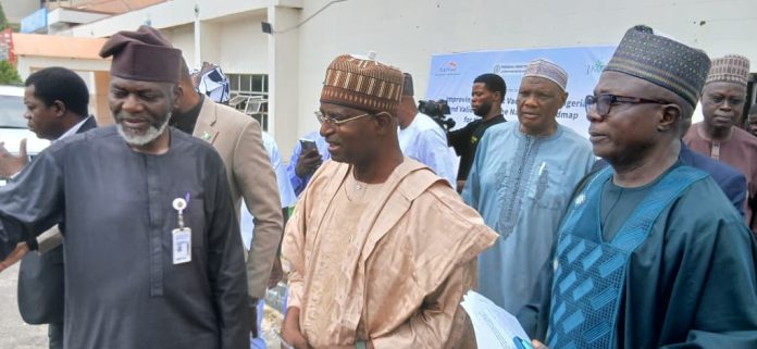 The Honourable Minister Federal Ministry of Livestock Development, Idi Mukhtar Maiha, flanked by the Chief Veterinary Officer, Dr Samuel Anzaku .