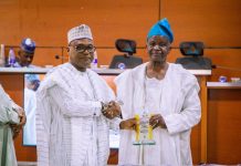 Secretary to the Government of the Federation, represented by the Director(General Services), Aliyu Idris Ibrahim,(left) receiving Award of Excellence at the Opening Ceremony of the 2026 National Risk Management Conference at Nigerian Army Resource Centre, Abuja.