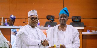 Secretary to the Government of the Federation, represented by the Director(General Services), Aliyu Idris Ibrahim,(left) receiving Award of Excellence at the Opening Ceremony of the 2026 National Risk Management Conference at Nigerian Army Resource Centre, Abuja.