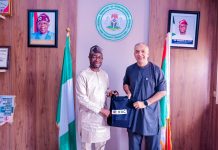 L-R : The honourable minister of Humanitarian Affairs and Poverty Reduction. Dr. Bernard M. Doro received a souvenir from the leader of the delegation Dr. Ghulam Muhammad Awan during the courtesy visit in his office.