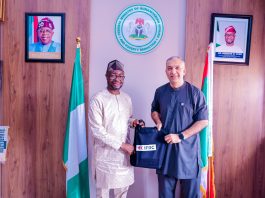 L-R : The honourable minister of Humanitarian Affairs and Poverty Reduction. Dr. Bernard M. Doro received a souvenir from the leader of the delegation Dr. Ghulam Muhammad Awan during the courtesy visit in his office.