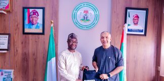 L-R : The honourable minister of Humanitarian Affairs and Poverty Reduction. Dr. Bernard M. Doro received a souvenir from the leader of the delegation Dr. Ghulam Muhammad Awan during the courtesy visit in his office.