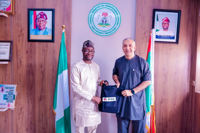 L-R : The honourable minister of Humanitarian Affairs and Poverty Reduction. Dr. Bernard M. Doro received a souvenir from the leader of the delegation Dr. Ghulam Muhammad Awan during the courtesy visit in his office.