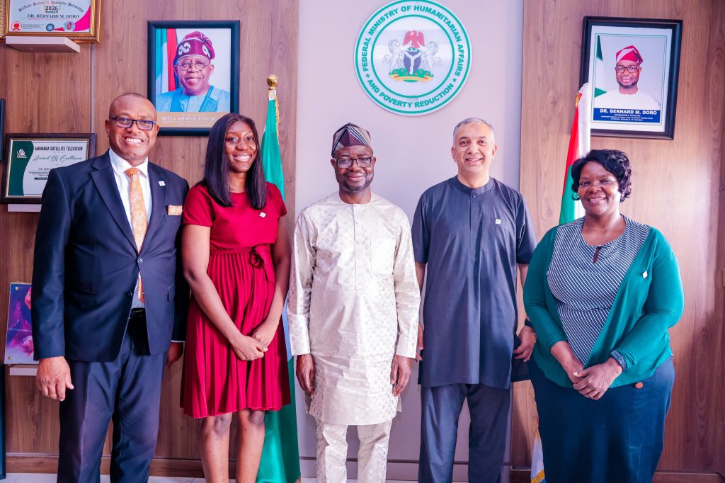 The honourable minister ( middle) Dr. Bernard M. Doro in a group photograph with the quest during the courtesy visit.