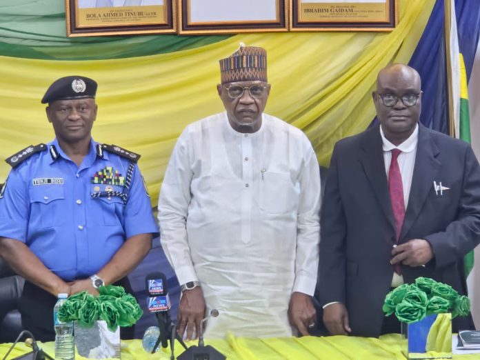 Pic-Middle-Minister of Police Affairs, Senator Ibrahim Gaidam,Right-IGP Olatunji Rilwan Disu and Left the Permanent Secretary of the Ministry of Police Affairs Dr. Ogbonnaya Anuma Nlia during the handing over of the newly gazetted Nigeria police Regulations(Amendment) Act at the Headquarters of the Ministry in Abuja.