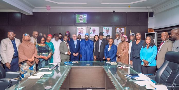 PHOTO-NEWS: Dr. Iziaq Adekunle Salako Honourable Minister of State for Health and Social Welfare (Center) flanked by his right is Dr. Boro Dropulic, leader of the delegation from Caring Cross, 2nd is Dr. Obi Adigwe, DG NIPRD; by his Left is Ms Shariha Khalid, 2nd is Dr John Ovuoraye, Director HPRS, representing the Permanent Secretary of Health, Daju Kachollom S. mni., 3rd is Dr. Adeola Olufowobi Dr. Food and Drugs Services, 4th is Dr. Amina Muhammad, Director, Child Health Division.